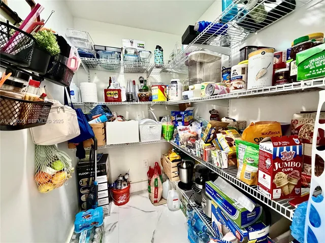 a kitchen with stove a refrigerator and dining table