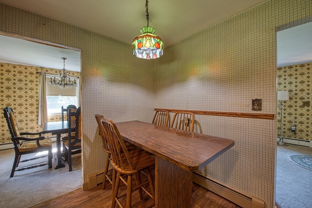 150 Pond Street Sharon, MA 02067 - Photo 12 of 26 a view of a dining room with furniture and a window