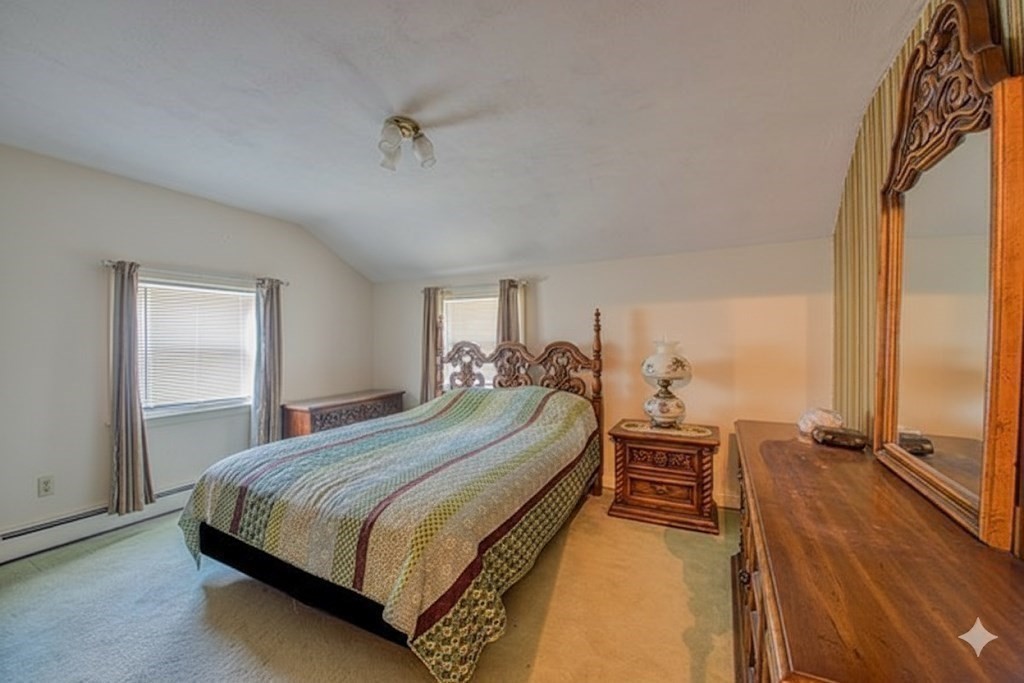 150 Pond Street Sharon, MA 02067 - Photo 13 of 26 a bed sitting in a spacious bedroom next to a window