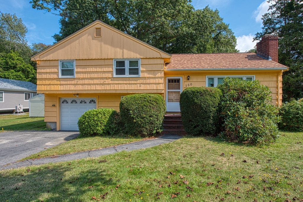 150 Pond Street Sharon, MA 02067 - Photo 2 of 26 a front view of a house with a yard