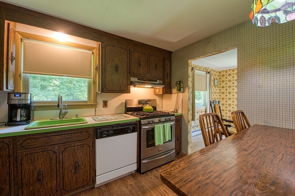 150 Pond Street Sharon, MA 02067 - Photo 10 of 26 a kitchen with stainless steel appliances a sink stove and cabinets