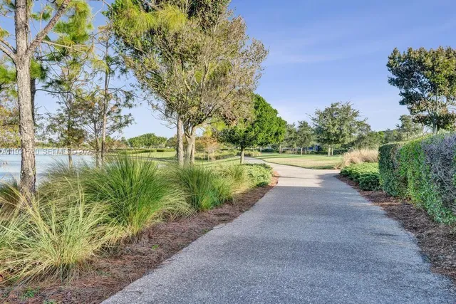 an aerial view of a house with a yard lake view and mountain view