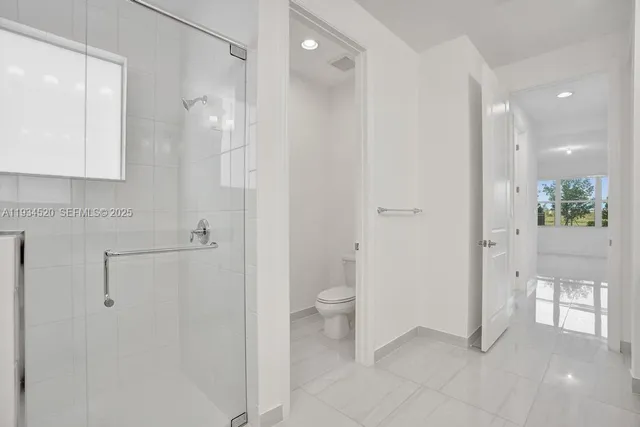 a bedroom with a bed and a cabinets