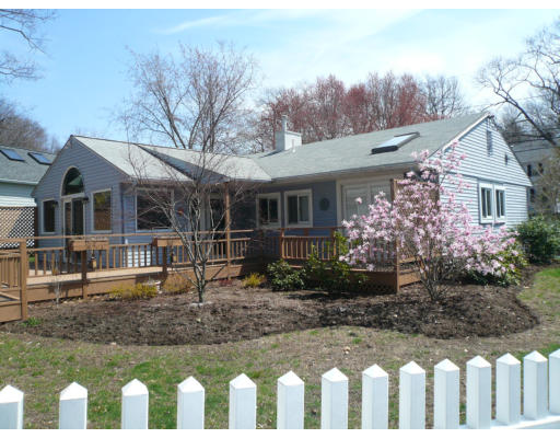 125 Hackensack Road Boston, MA 02467 - Photo 1 of 7 a front view of a house with garden