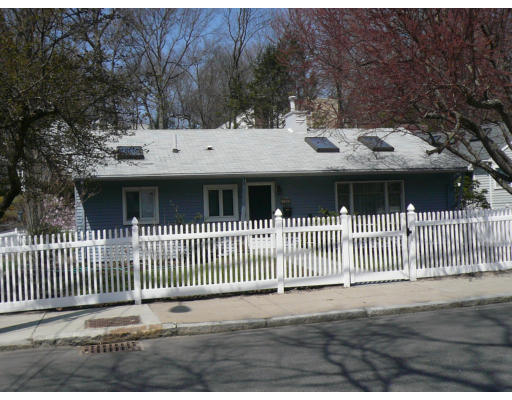 125 Hackensack Road Boston, MA 02467 - Photo 2 of 7 a front view of a house with a garden