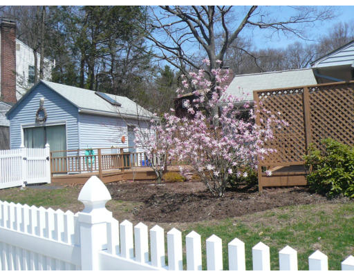 125 Hackensack Road Boston, MA 02467 - Photo 3 of 7 a front view of a house with a yard