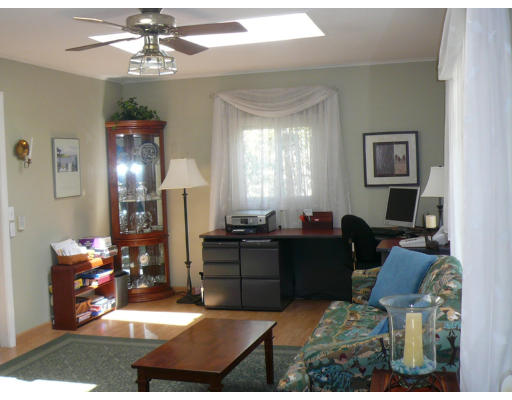125 Hackensack Road Boston, MA 02467 - Photo 4 of 7 a living room with furniture and a chandelier