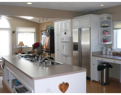 125 Hackensack Road Boston, MA 02467 - Photo 5 of 7 a kitchen with stainless steel appliances granite countertop a sink a stove and a refrigerator