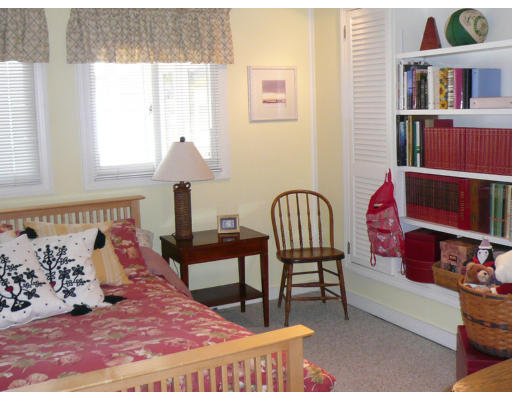 125 Hackensack Road Boston, MA 02467 - Photo 6 of 7 a bedroom with a bed and a window