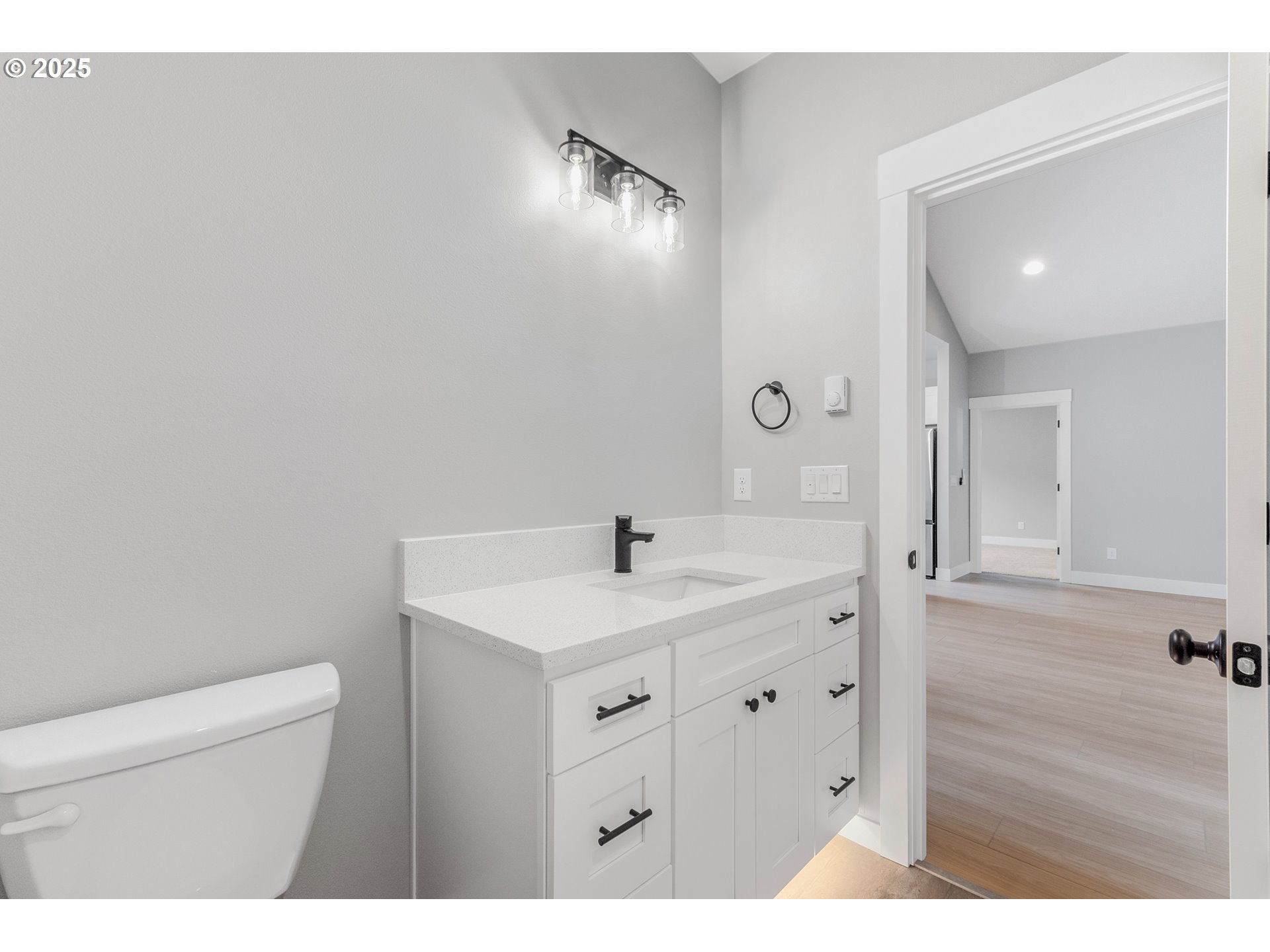 623 Vertex Street Winlock, WA 98596 - Photo 26 of 38 a bathroom with a sink a toilet and a mirror