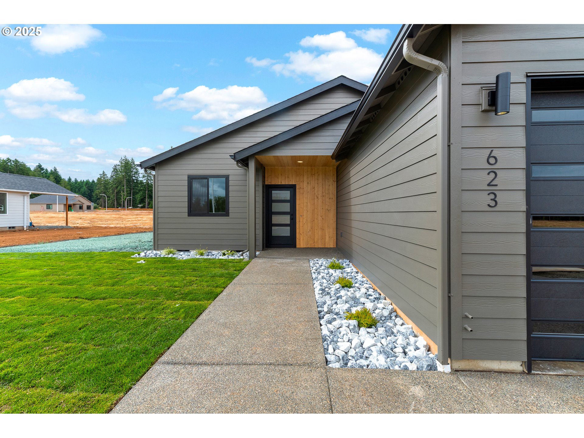 623 Vertex Street Winlock, WA 98596 - Photo 33 of 38 a backyard of a house with lots of green space