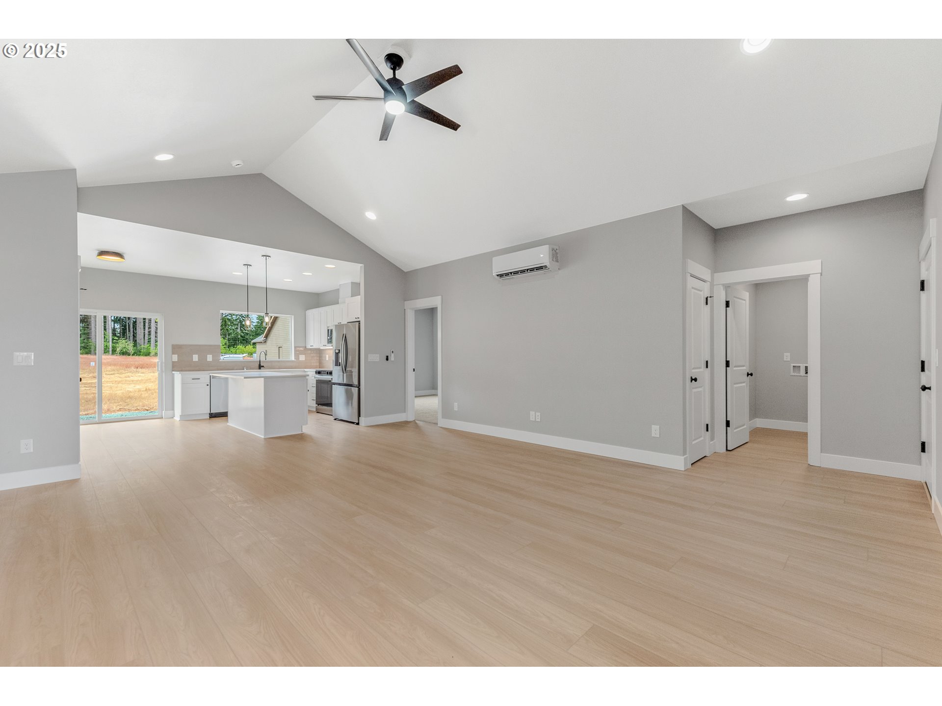 623 Vertex Street Winlock, WA 98596 - Photo 4 of 38 a view of a livingroom with a ceiling fan window and wooden floor