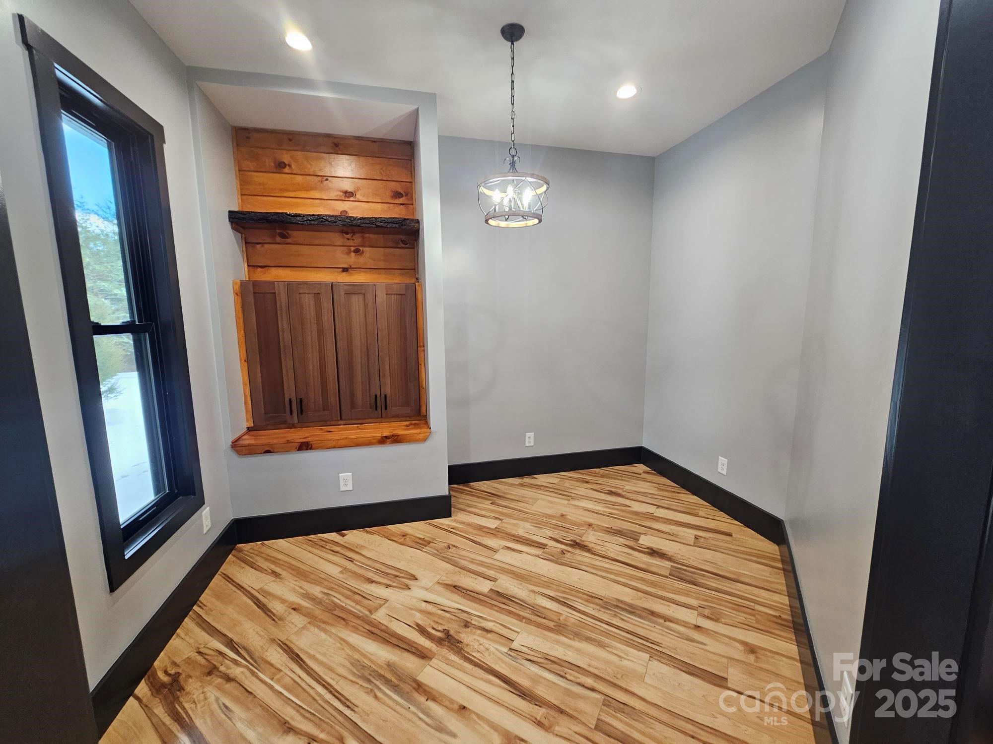 1076 Table View Drive, Unit 55 Morganton, NC 28655 - Photo 21 of 33 a view of empty room with wooden floor