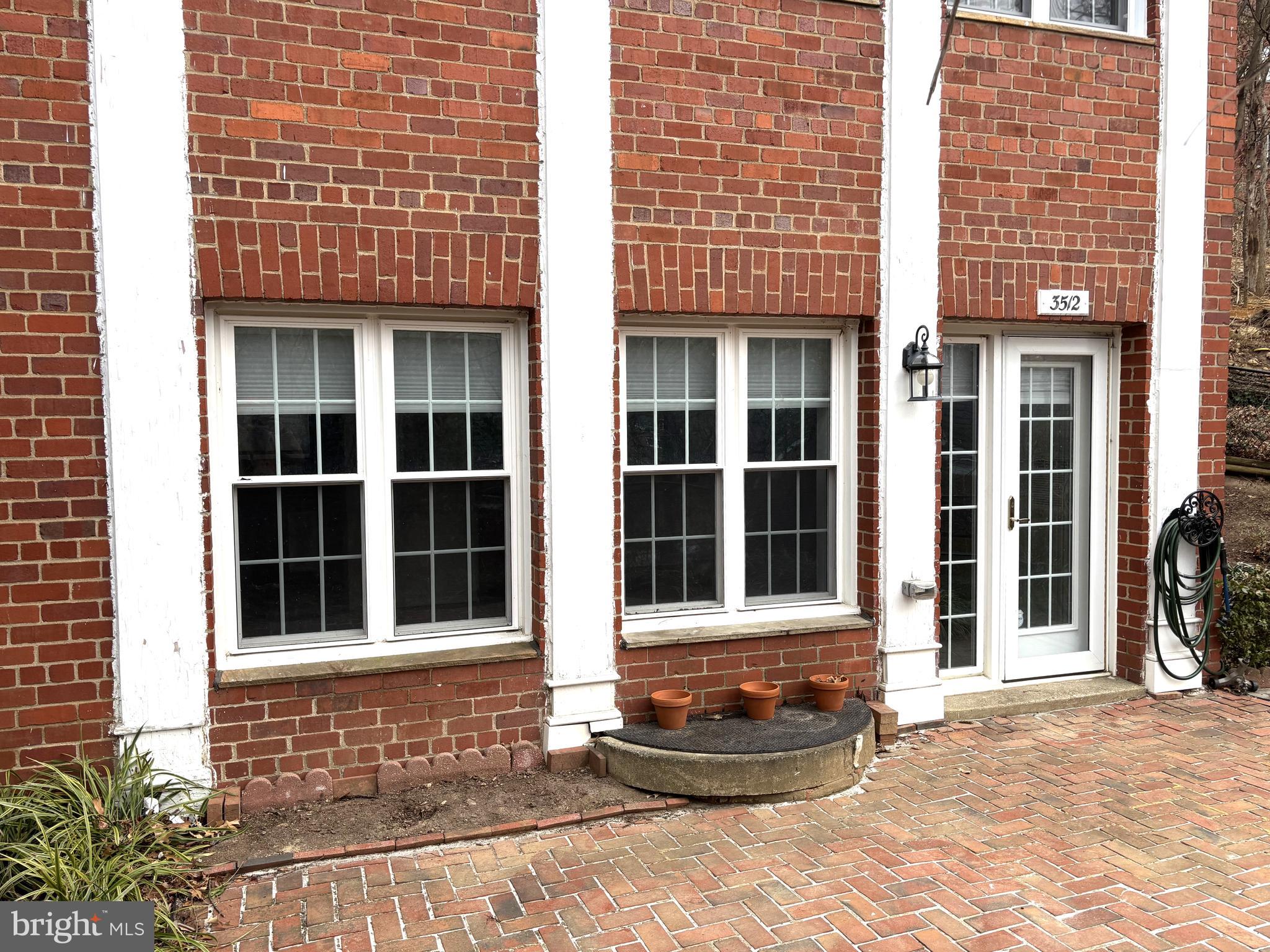 3512 Gunston Road Alexandria, VA 22302 - Photo 3 of 29 a front view of a brick building with a window