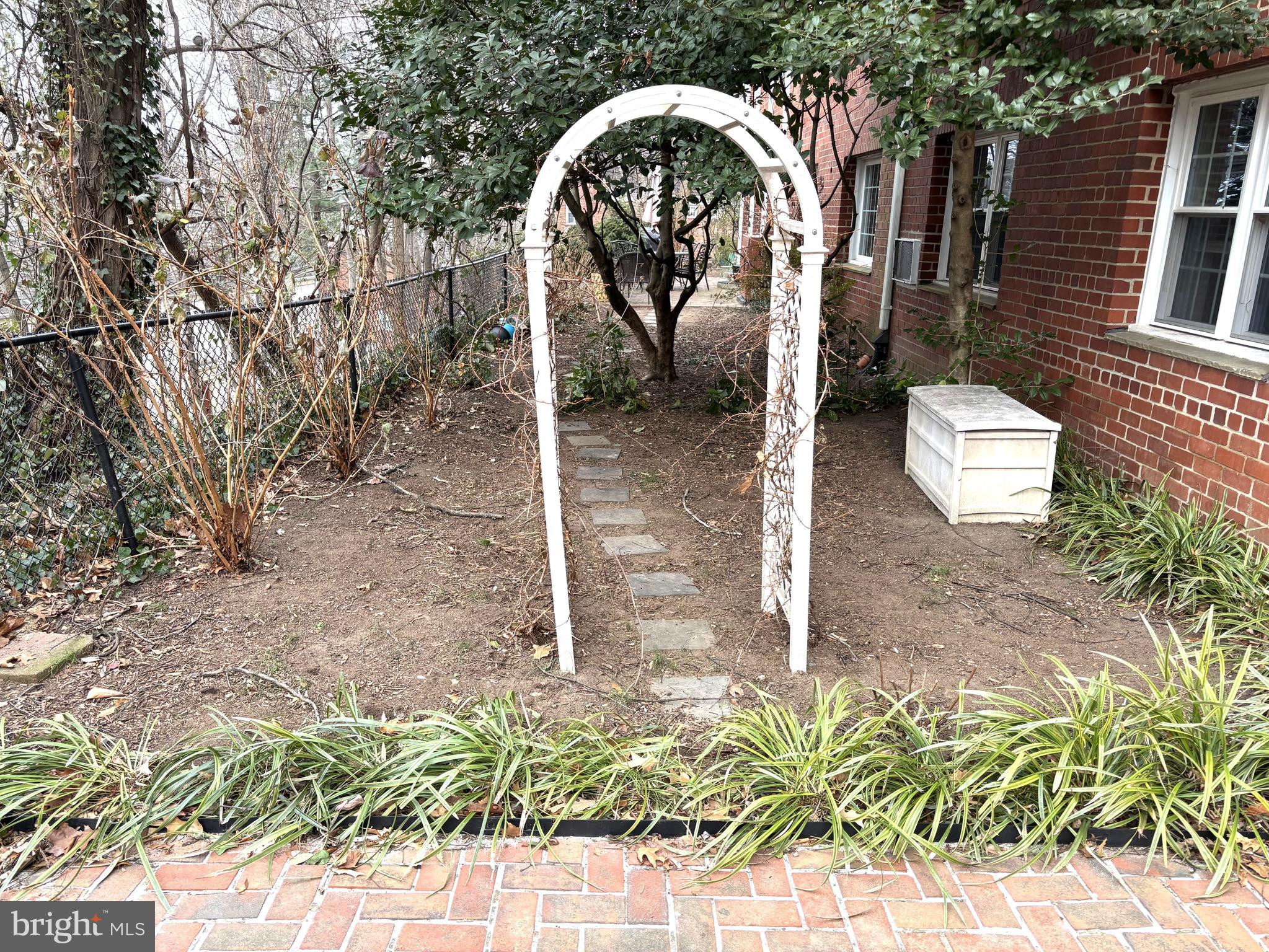 3512 Gunston Road Alexandria, VA 22302 - Photo 5 of 29 a view of a garden with a fountain