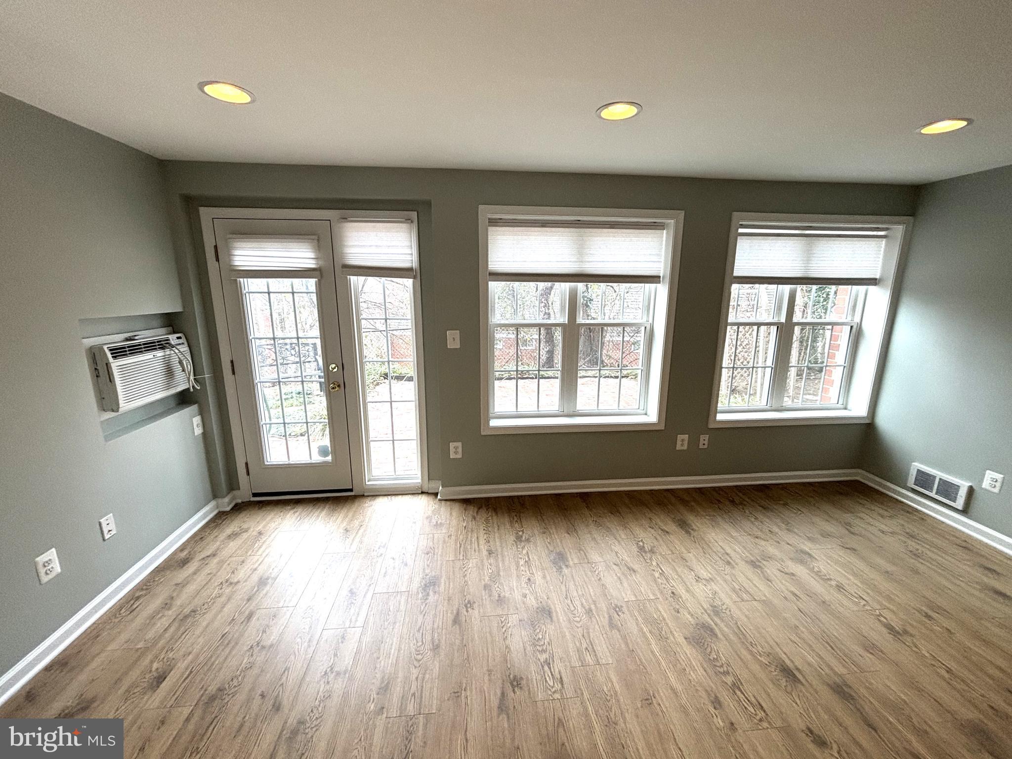 3512 Gunston Road Alexandria, VA 22302 - Photo 6 of 29 an empty room with wooden floor and windows