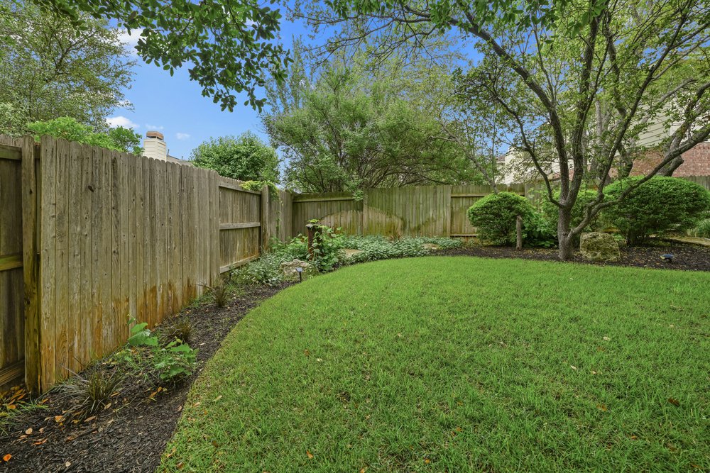 2823 Lantana Ridge Drive Austin, TX 78732 - Photo 33 of 34 a view of a backyard with large trees