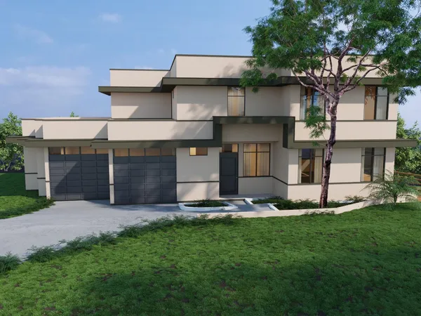 a front view of a house with a garden and yard