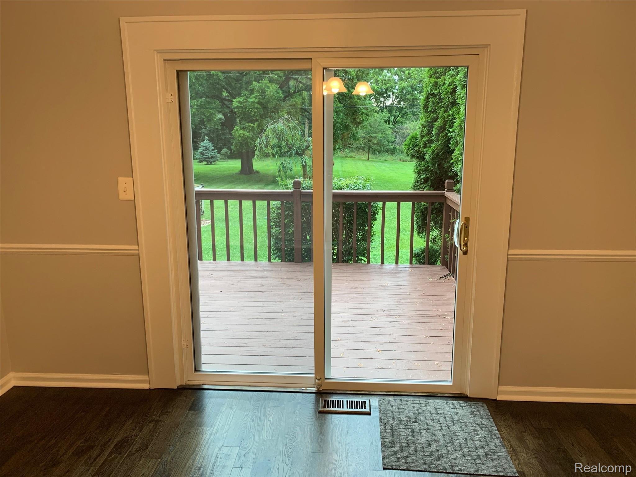 4859 Crooked Lake Road Howell, MI 48843 - Photo 24 of 90 Doorwall to deck and backyard off dining room