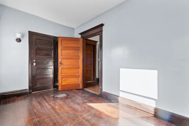 a view of an empty room with closet area