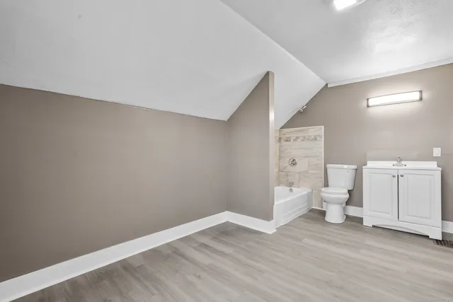 a bathroom with a sink a toilet and a bathtub