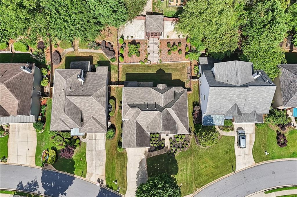 810 Freedom Way Cumming, GA 30040 - Photo 55 of 61 an aerial view of multiple houses with outdoor space