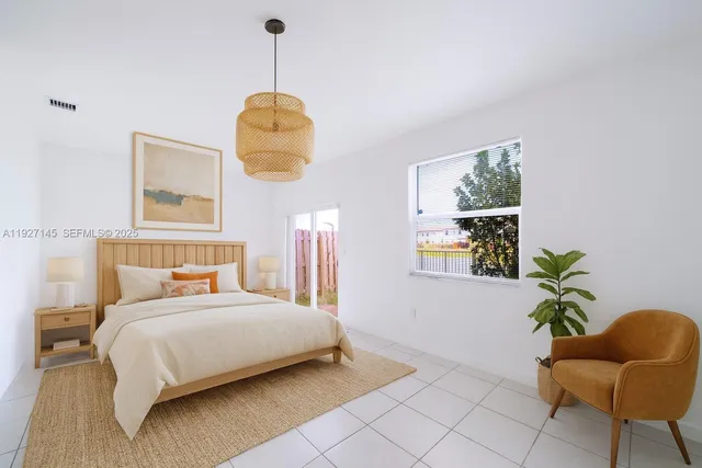 a bedroom with bed and a window