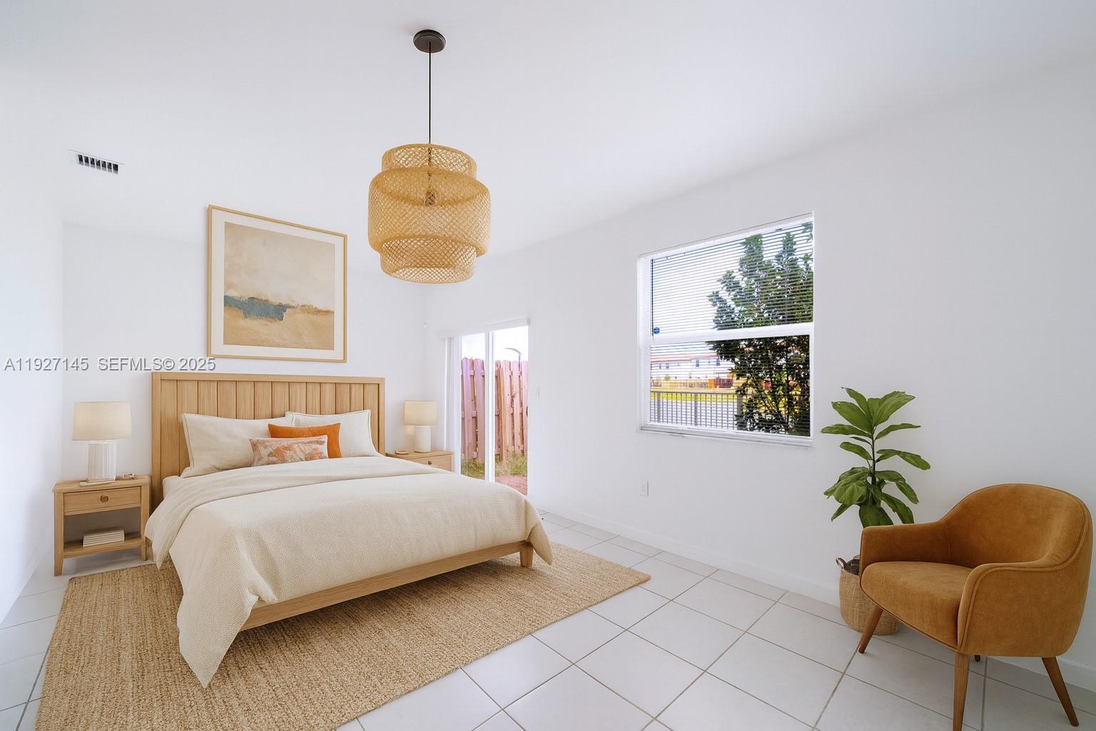 12661 Northwest 23rd Place Miami, FL 33167 - Photo 12 of 34 a bedroom with bed and a window