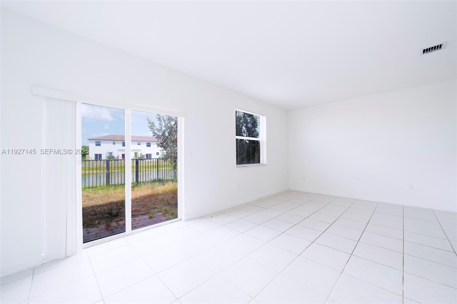 12661 Northwest 23rd Place Miami, FL 33167 - Photo 15 of 34 an empty room with windows