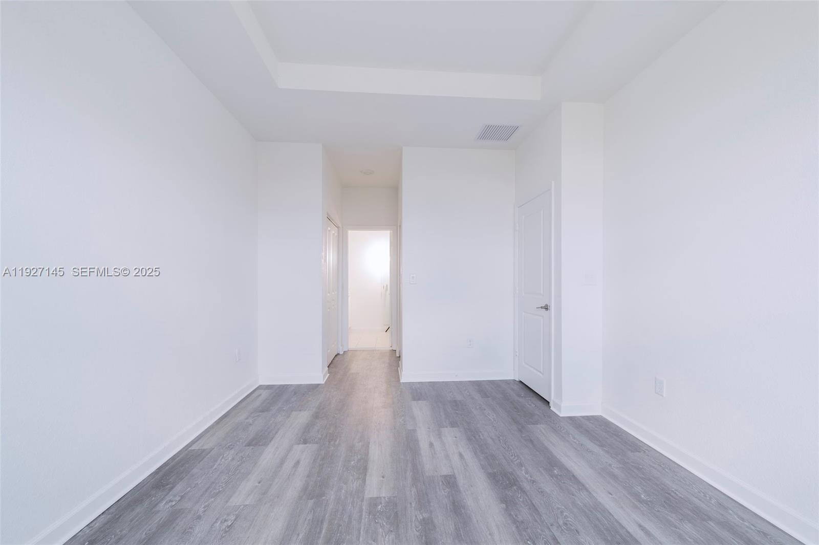 12661 Northwest 23rd Place Miami, FL 33167 - Photo 21 of 34 a view of a room with wooden floor