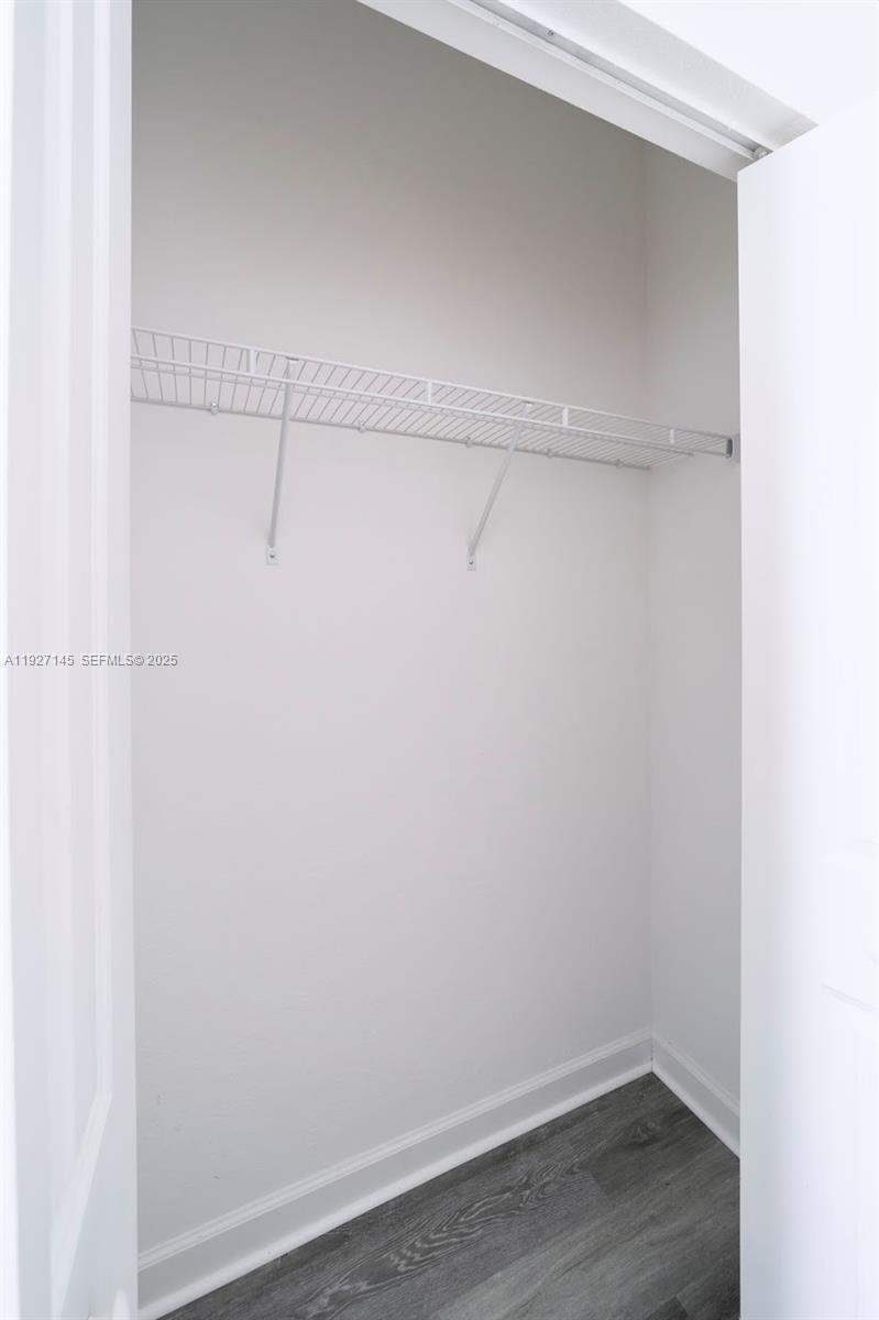 12661 Northwest 23rd Place Miami, FL 33167 - Photo 31 of 34 a view of a room with racks on the wall