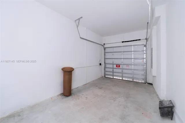 a view of an empty room with storage