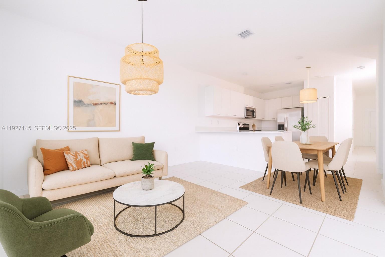 12661 Northwest 23rd Place Miami, FL 33167 - Photo 8 of 34 a living room with furniture and a dining table