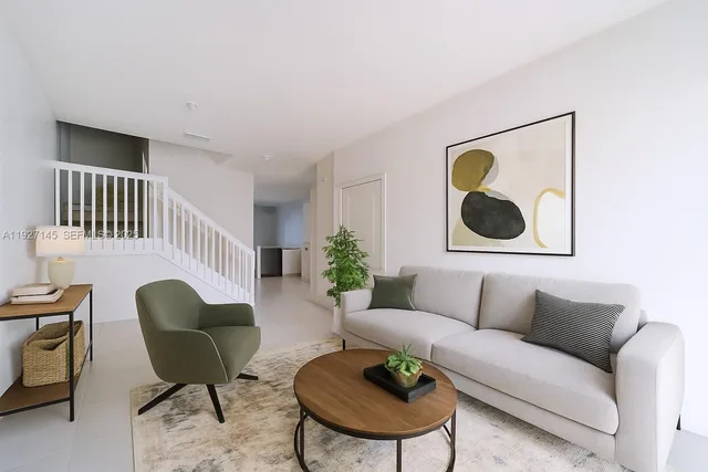 a living room with furniture and a rug