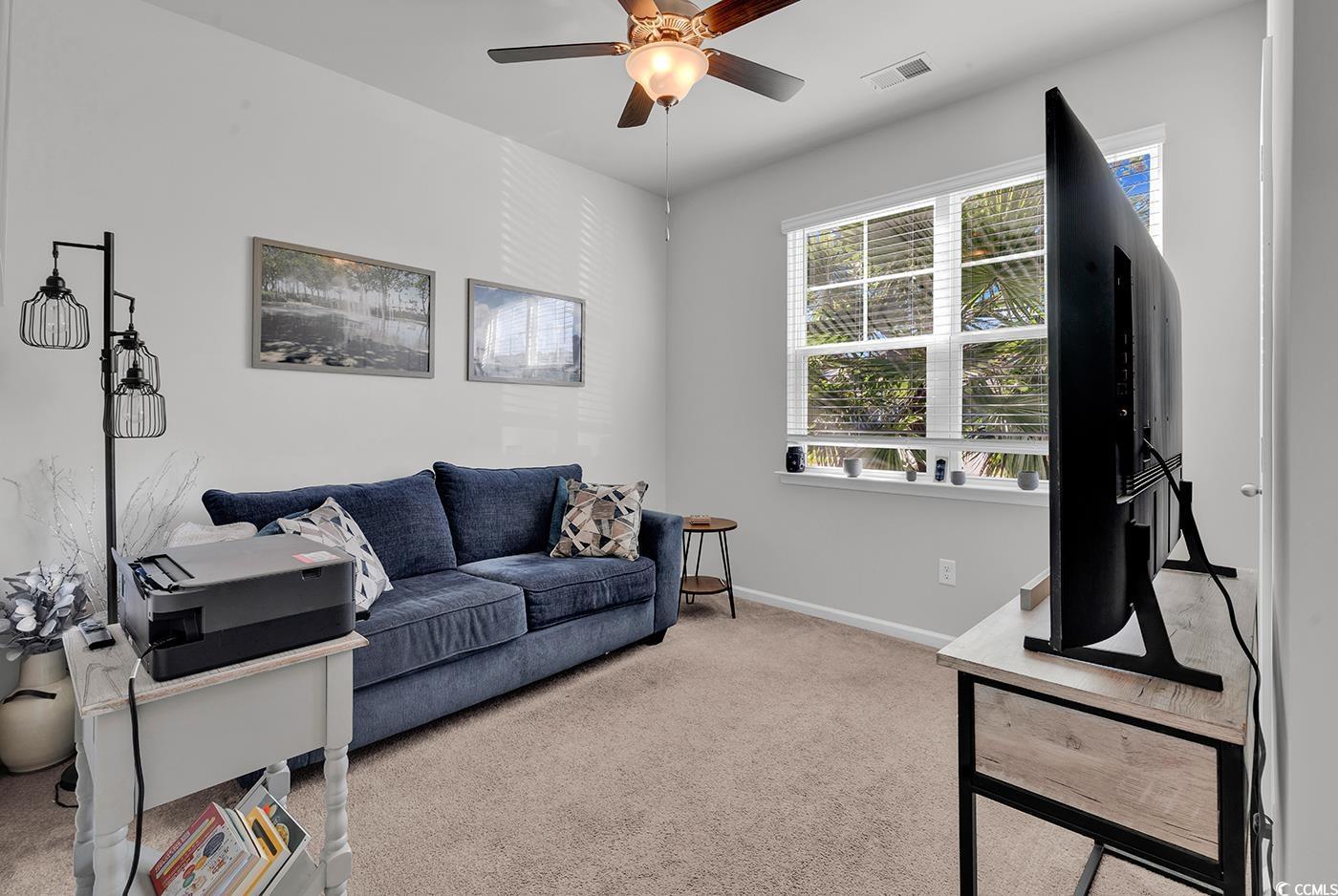 2565 Orion Loop Myrtle Beach, SC 29577 - Photo 4 of 35 Living area featuring light carpet and ceiling fan