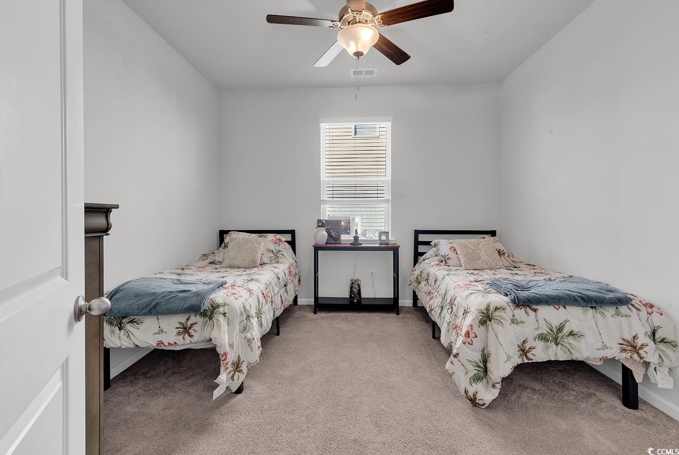 2565 Orion Loop Myrtle Beach, SC 29577 - Photo 8 of 35 Carpeted bedroom with ceiling fan