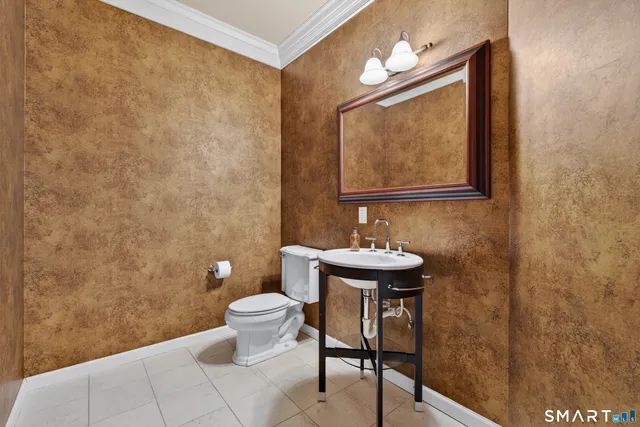 a kitchen with center island and stainless steel appliances