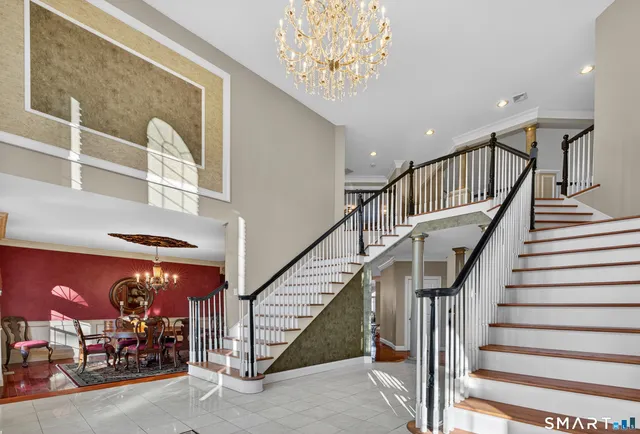 a bedroom with a bed chair and window