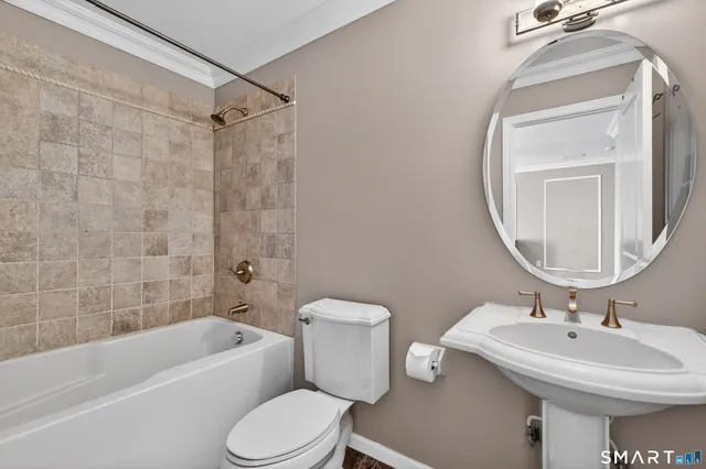 a spacious bedroom with a bed and a large window