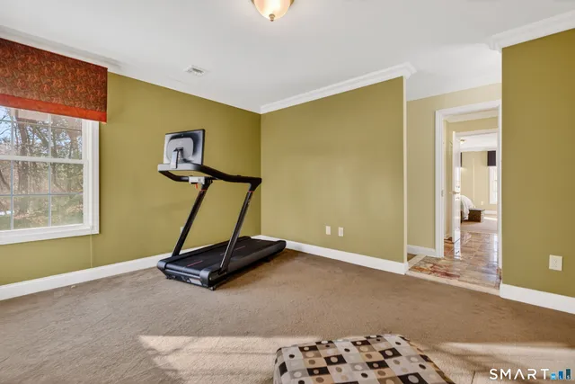 a view of a swimming pool with outdoor seating and trees