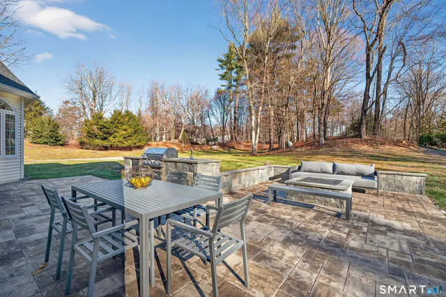 a view of a swimming pool with chairs in roof deck