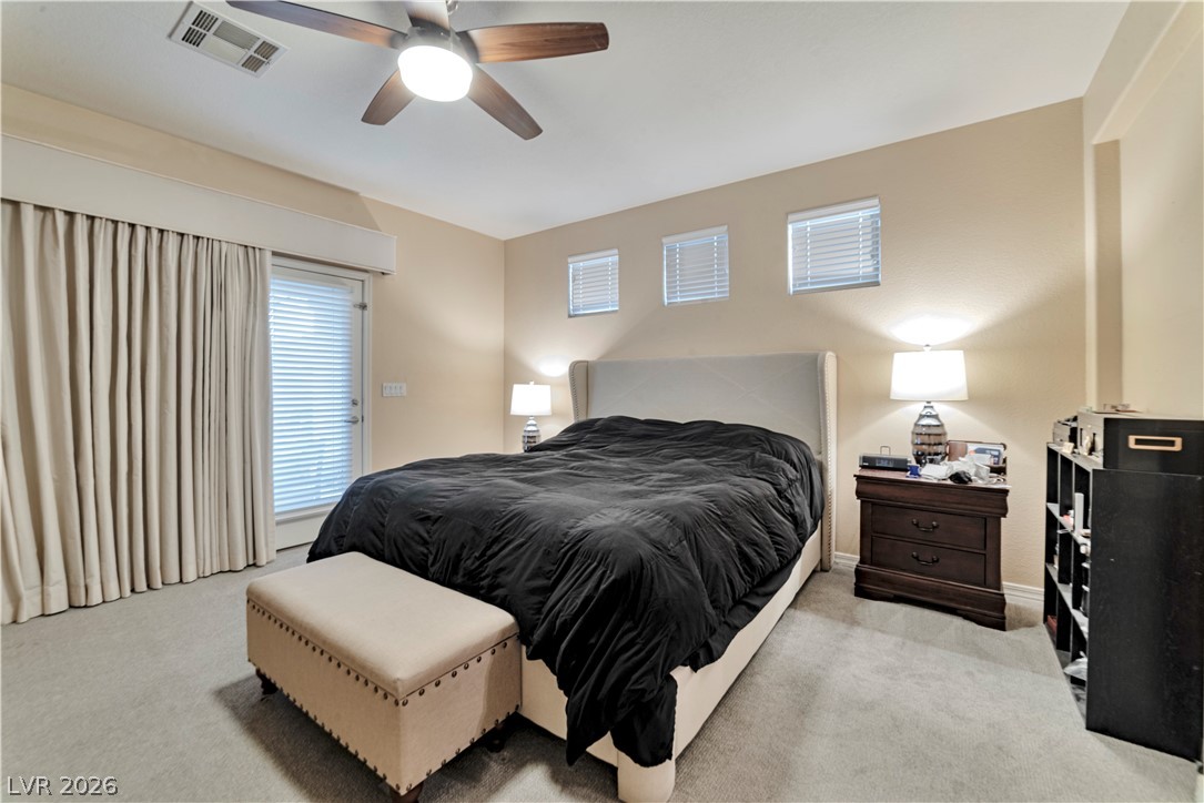 5915 Karnes Ranch Avenue Las Vegas, NV 89131 - Photo 2 of 28 Bedroom with light carpet and ceiling fan