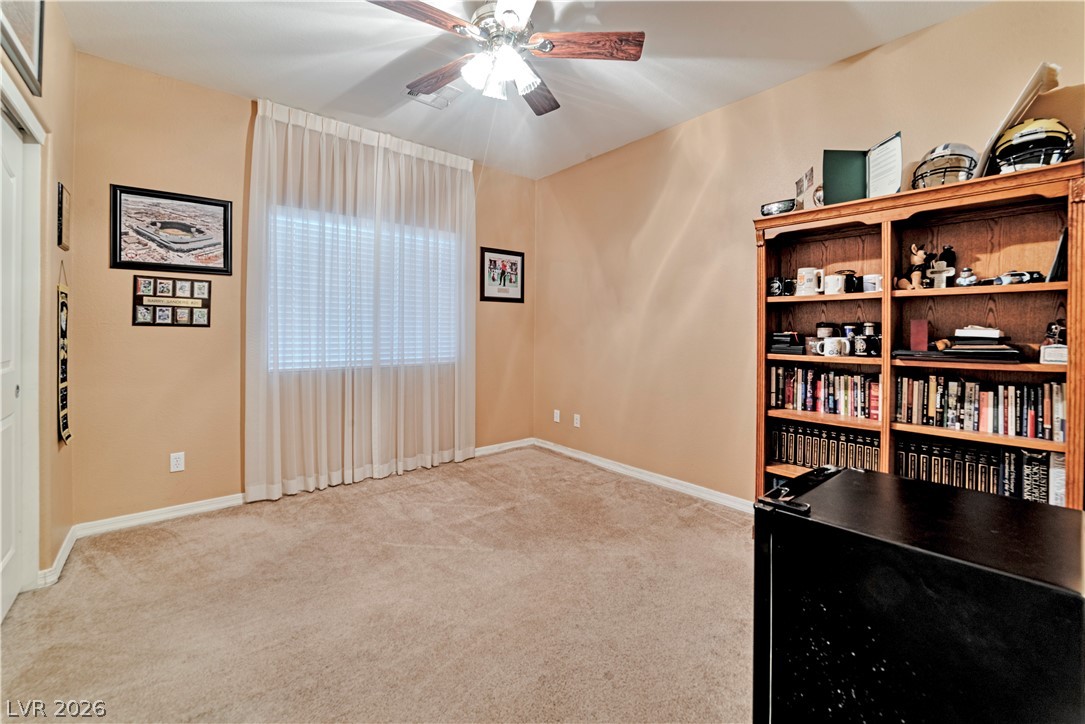 5915 Karnes Ranch Avenue Las Vegas, NV 89131 - Photo 9 of 28 Unfurnished office featuring light colored carpet and a ceiling fan