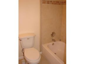 3197 Northeast Eastman Palm Bay, FL 32905 - Photo 8 of 11 a bathroom with a toilet and a tub