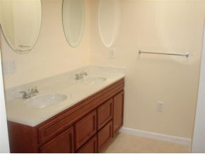 3197 Northeast Eastman Palm Bay, FL 32905 - Photo 10 of 11 a bathroom with a sink and a mirror