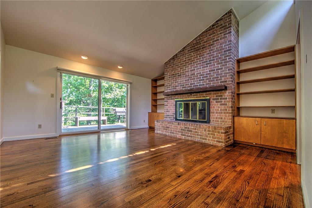 150 Riding Trail Lane Fox Chapel, PA 15215 - Photo 14 of 25 Family Room has fireplace, built-in shelves and gleaming hard wood floors