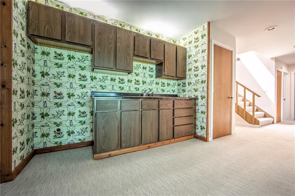 150 Riding Trail Lane Fox Chapel, PA 15215 - Photo 19 of 25 Gameroom has wet bar and plenty of cabinetry and storage