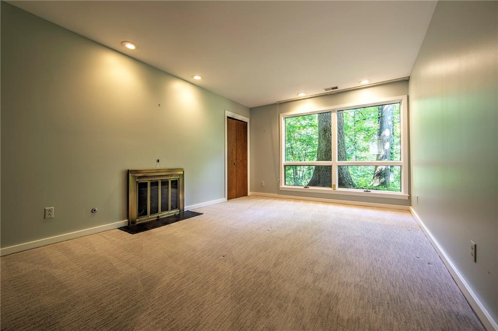 150 Riding Trail Lane Fox Chapel, PA 15215 - Photo 21 of 25 Bedroom #3 offers a cozy fireplace and tranquil views of the woods