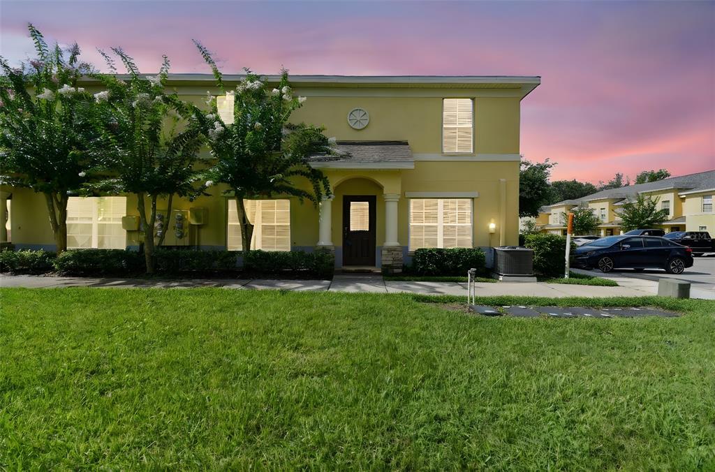 6262 Maisai Road Zephyrhills, FL 33542 - Photo 1 of 1 a front view of a house with a yard