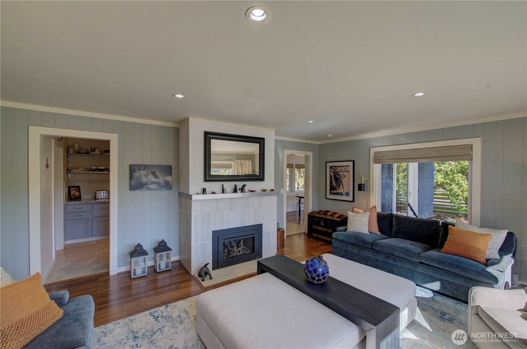 1115 34 Street Seaview, WA 98644 - Photo 12 of 31 a living room with furniture a fireplace and a flat screen tv